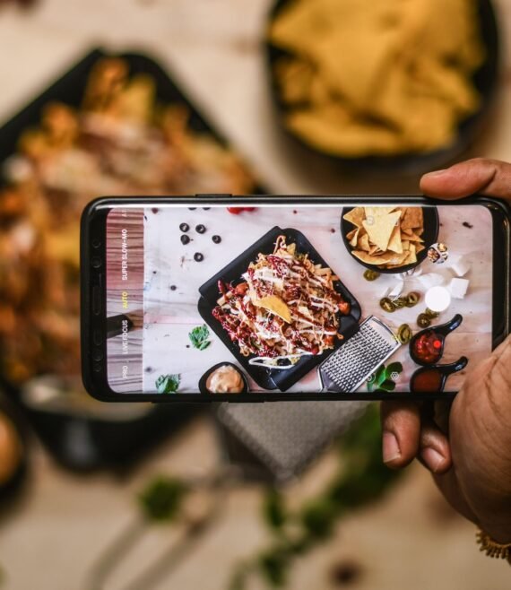 high-angle-view-person-holding-smart-phone-min